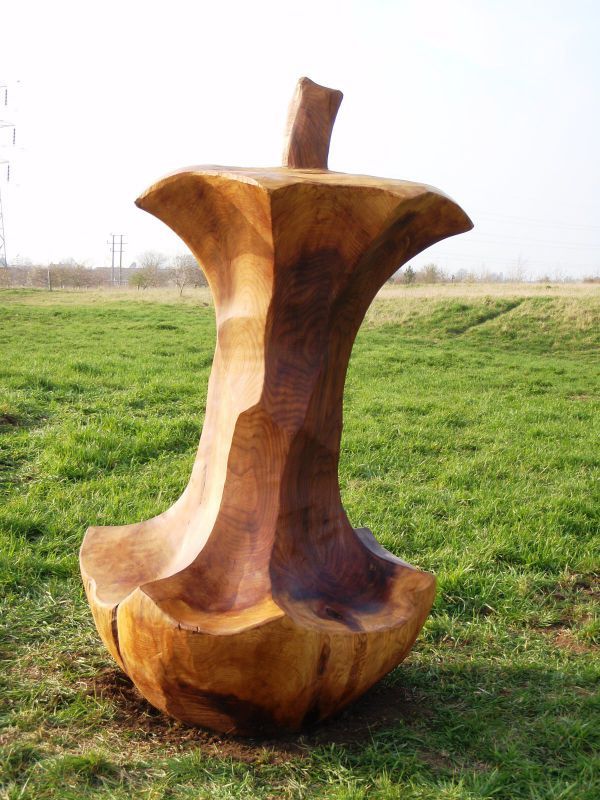 'Apple Seat (Large Carved Wood Half Eaten statue)' by Nigel Sardeson