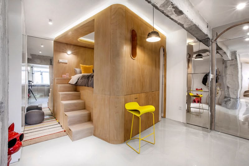 This Small Apartment Has A Raised Bed Within A Wood Box
