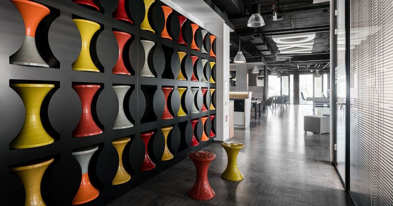 Design Detail - A Wall In This Office Was Used To Create Stool Storage