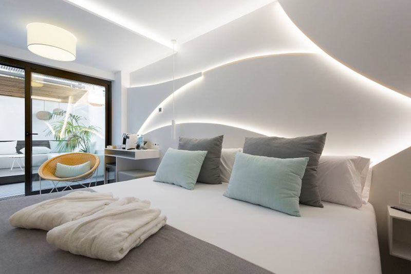 Design Detail - A Sculptural Backlit Headboard Was Added To This Hotel Room