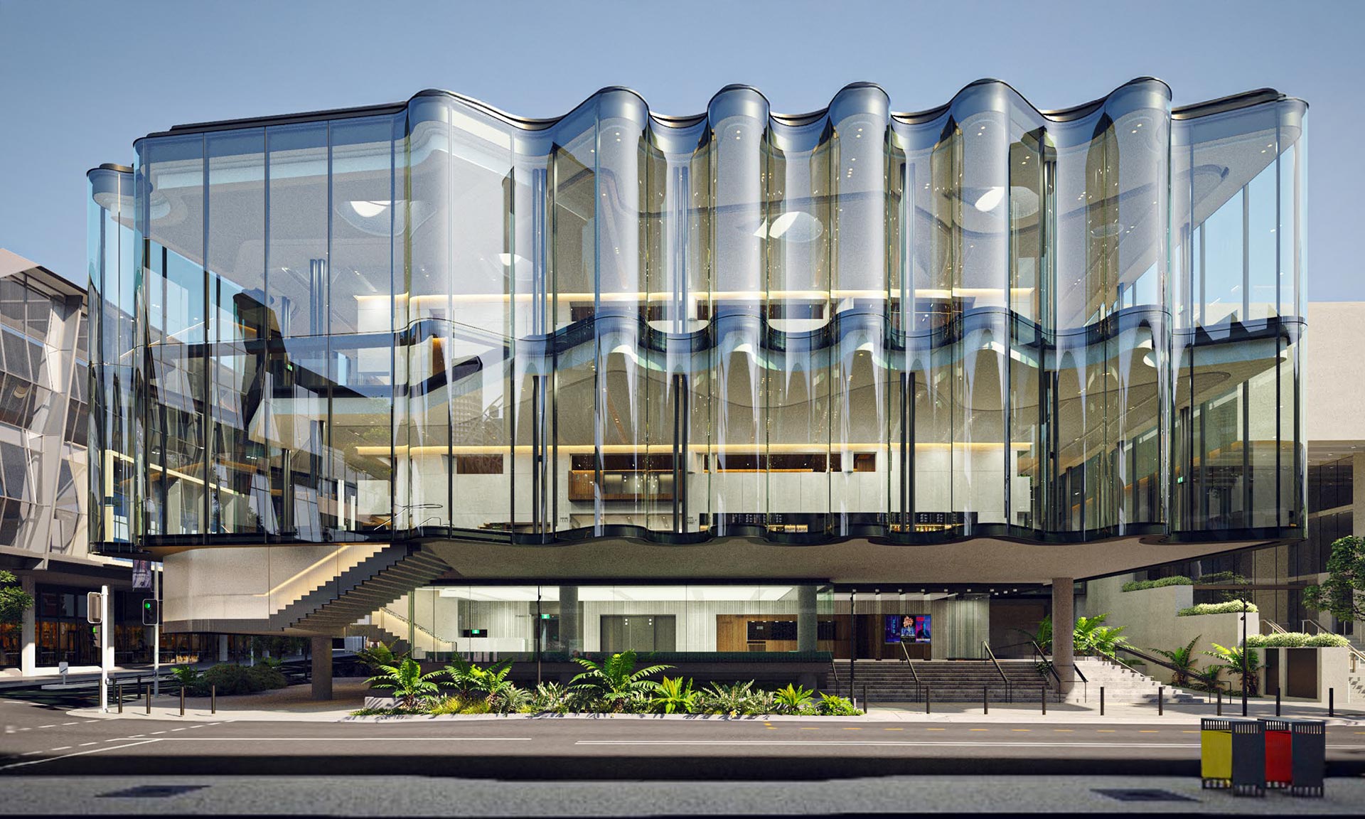 Snøhetta staví Queensland Performing Arts Centre s rozvlněnou skleněnou fasádou ve tvaru opony  – DesignMag.cz